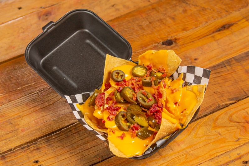 Loaded Nachos Grande with jalapeños and all toppings at Chuys